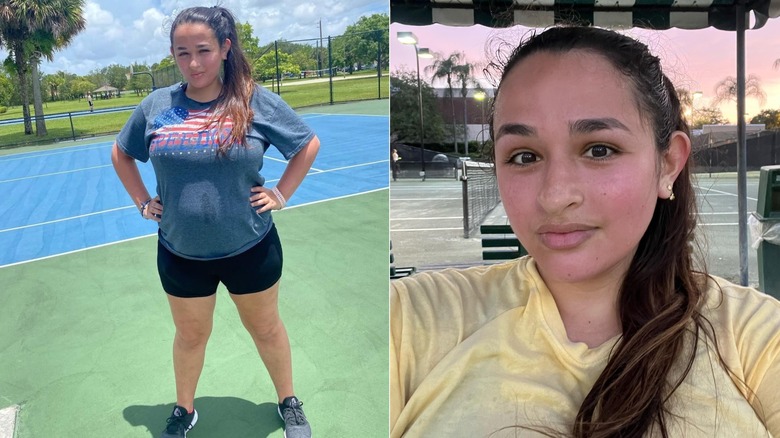 Jazz Jennings posing with her hands on her hips in front of a tennis court and taking a selfie with a court in the background