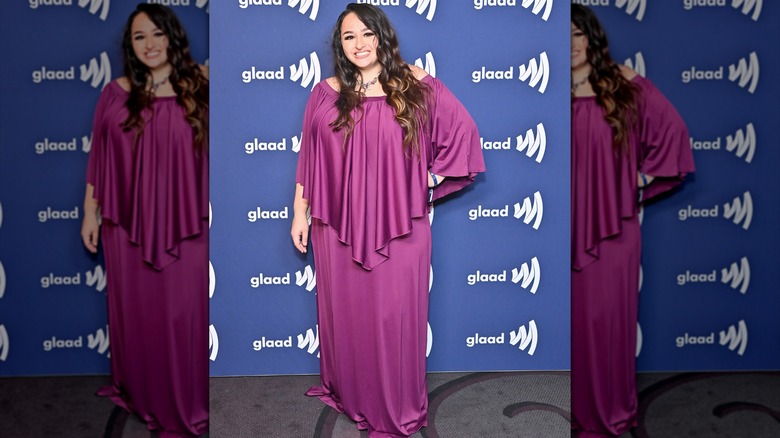 Jazz Jennings posing in a purple set in 2022.