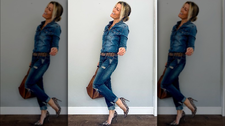 Woman wearing denim, belt, heels