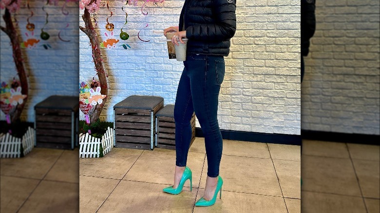 Woman wearing skinny jeans, heels