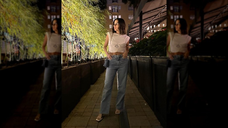 Woman wearing wide-leg jeans, heels