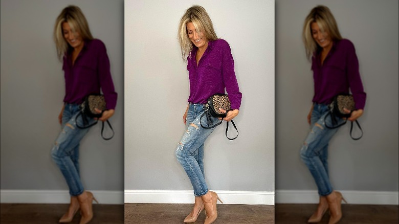 Woman wearing cuffed jeans, heels