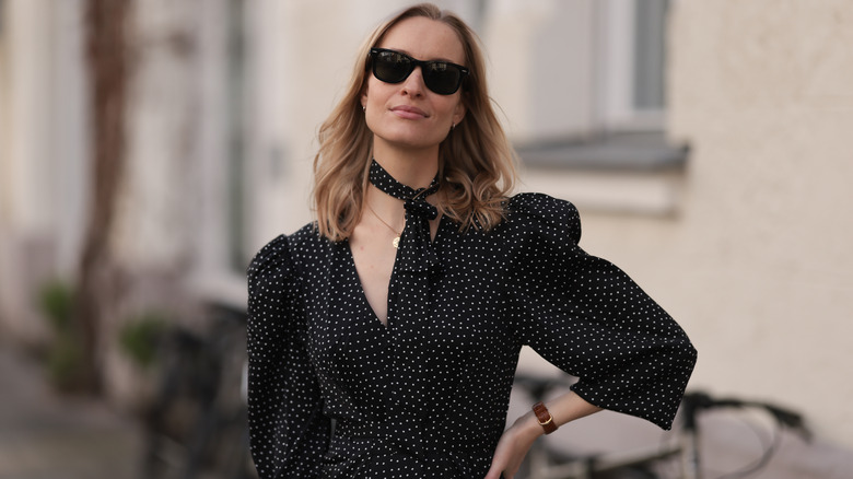 woman in polka dot tie