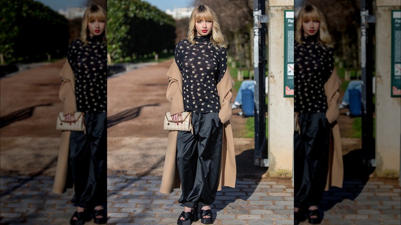 woman in polka dot black top