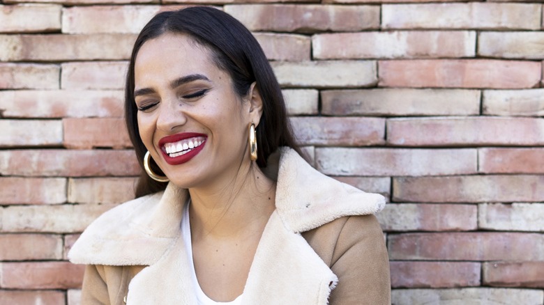 Woman wearing thick hoop earrings