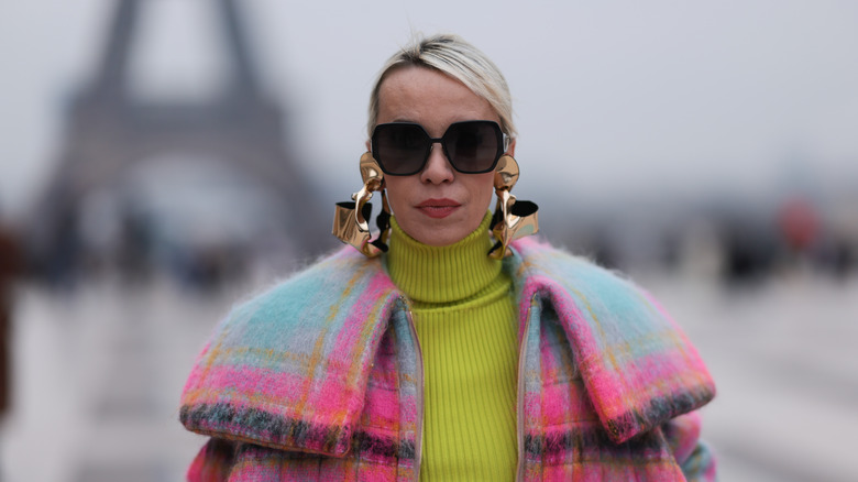 Woman wearing XXL earrings