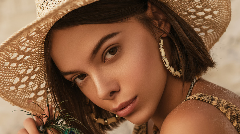 woman wearing large hoop earrings