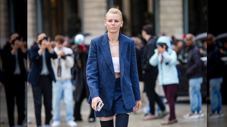 Woman wearing denim blazer, jorts