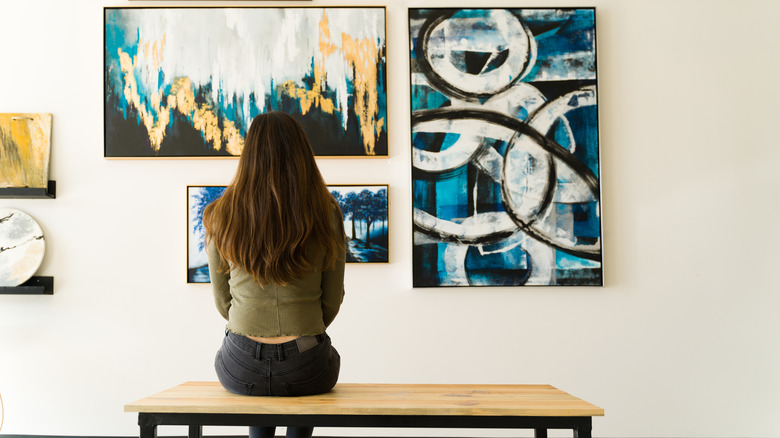 young woman painting abstract art