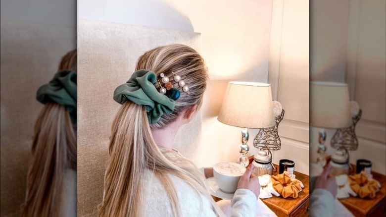 girl wearing sage scrunchie