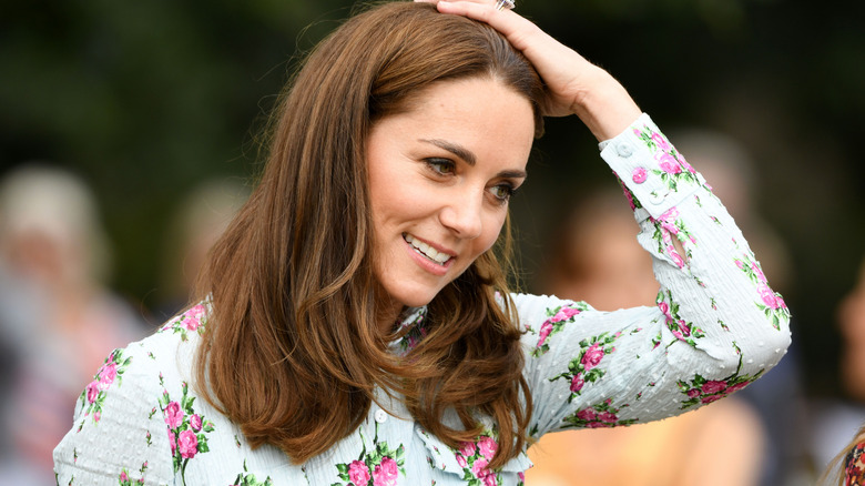 Kate Middleton touching head