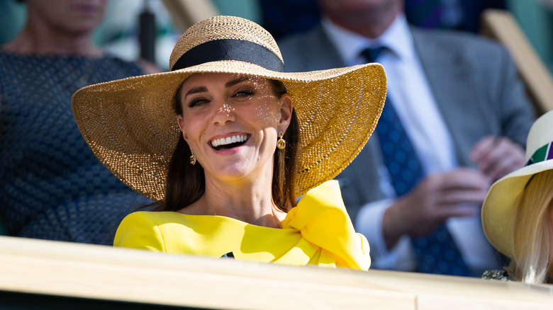 Kate Middleton smiling in yellow