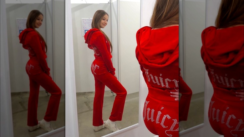 Girl wearing a red Juicy Couture tracksuit.