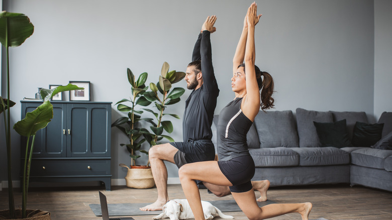 Man and woman doing yoga