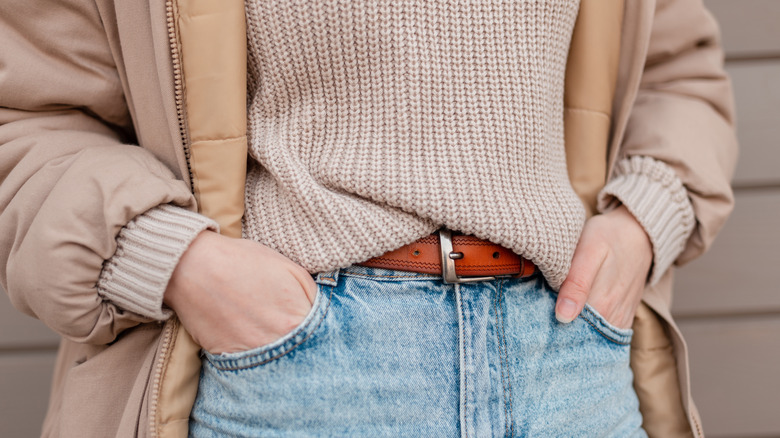 Girl wearing a belt with buckle