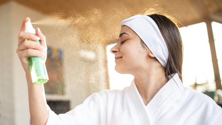 woman using setting spray