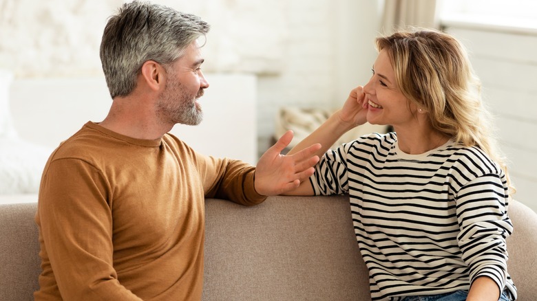 older couple talking on couch