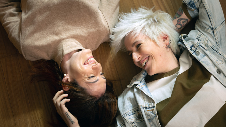 couple laying on floor talking