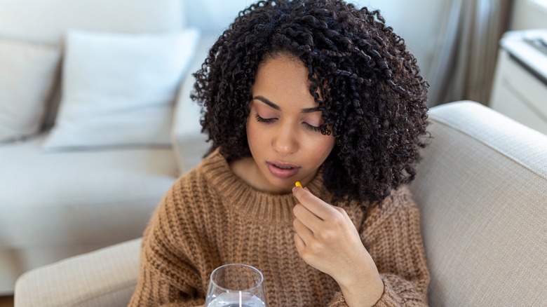 Woman taking pill