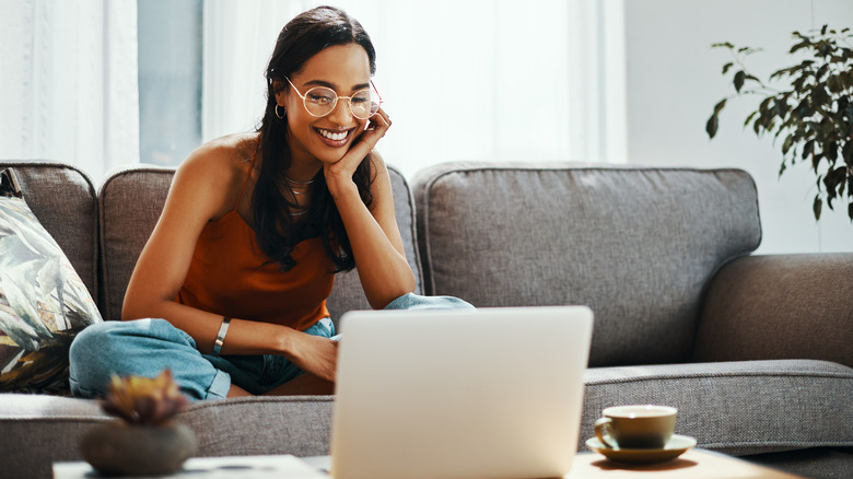 woman using laptop at home