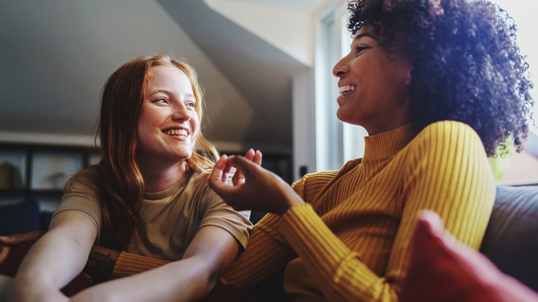 two happy women talking