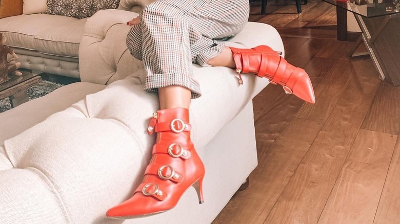 woman wearing kitten heel boots