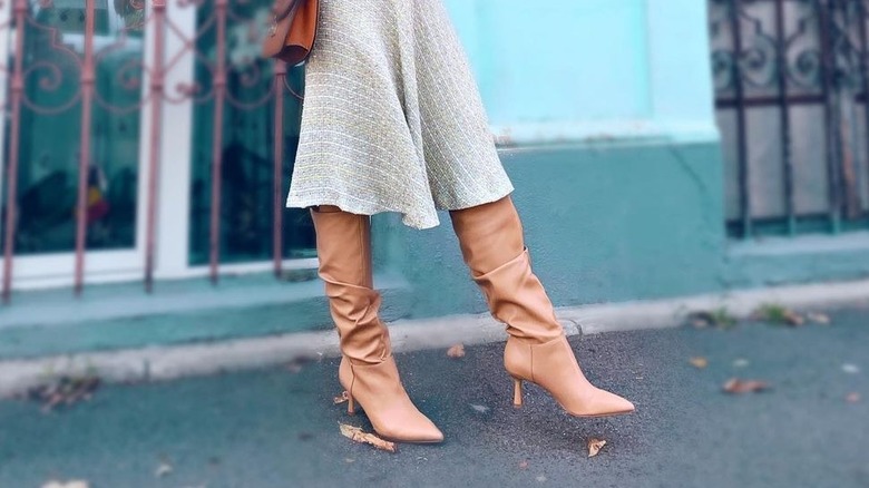 woman wearing kitten heel boots