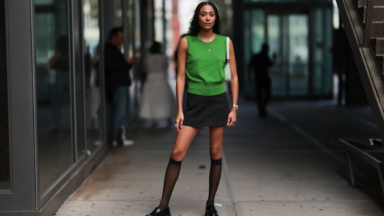 woman wearing sheer knee-high socks