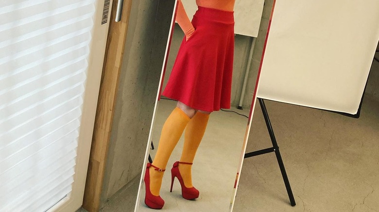 red Knee-length skirt yellow knee-high socks