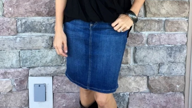 Knee-length denim skirt black top