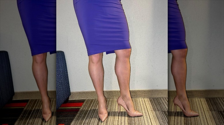 blue form-fitting knee length skirt showing tan legs