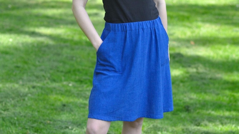 Royal blue knee-length skirt hands in pockets