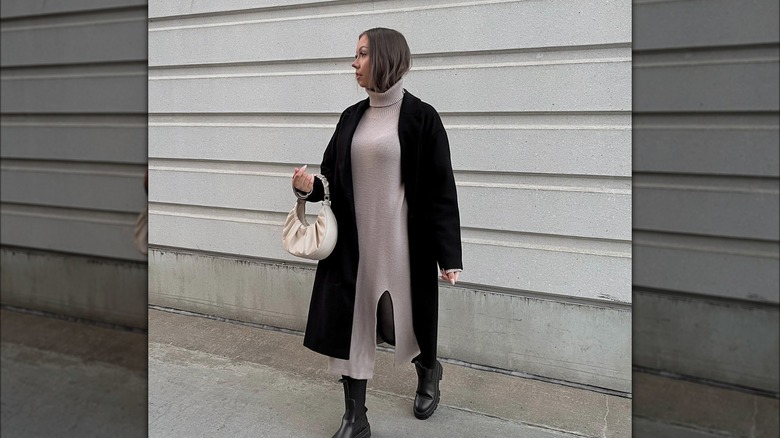 Girl wearing a trench coat with a knit maxi dress