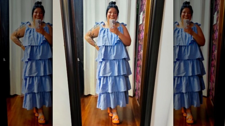 Woman wearing blue ruffled dress