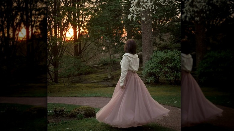 Woman in long loose skirt