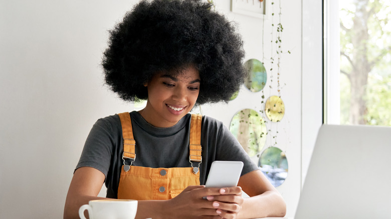 woman looking at her phone