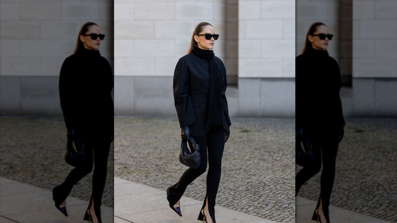 woman in black collarless blazer