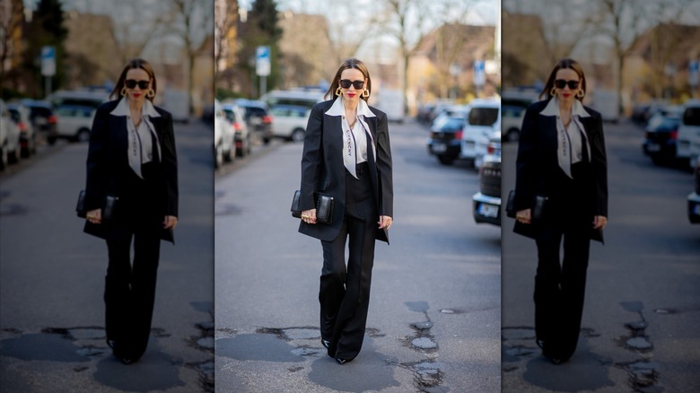 woman in black collarless blazer