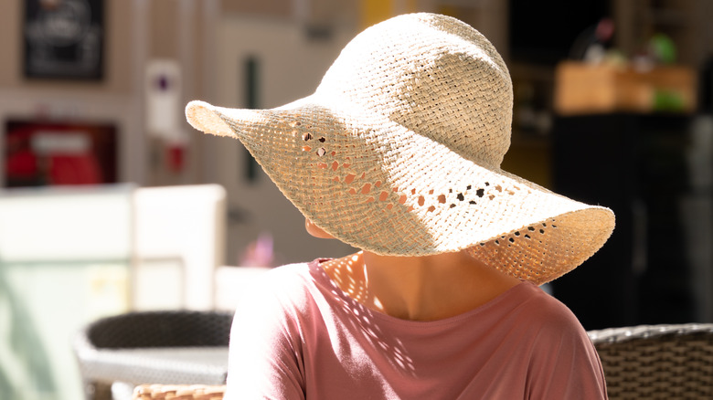 woman wearing sun hat