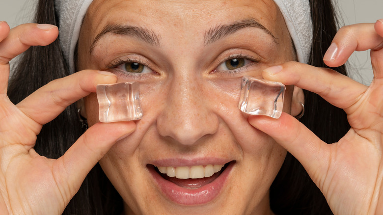 woman icing her eyes