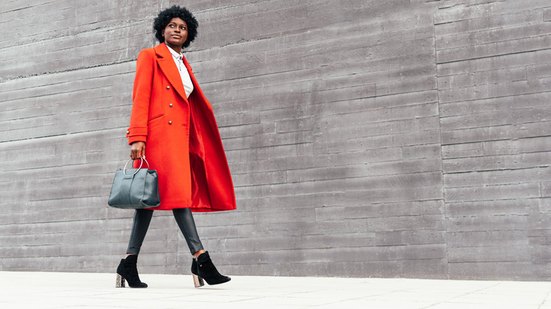 Woman in red pea coat 