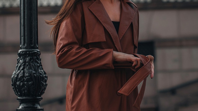 Woman in leather trench coat