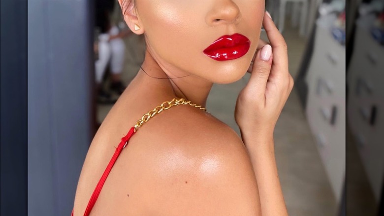 Woman with red latex lips