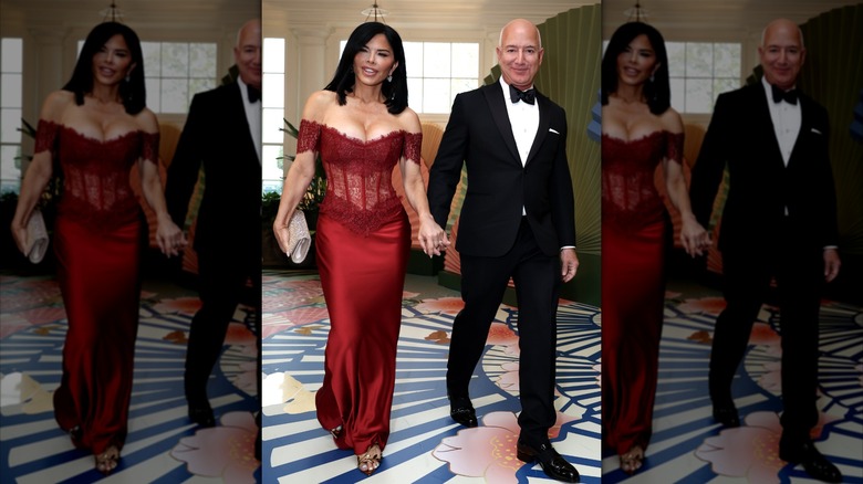 Lauren Sánchez wearing a lacy red corset dress to attend a state dinner with Jeff Bezos.