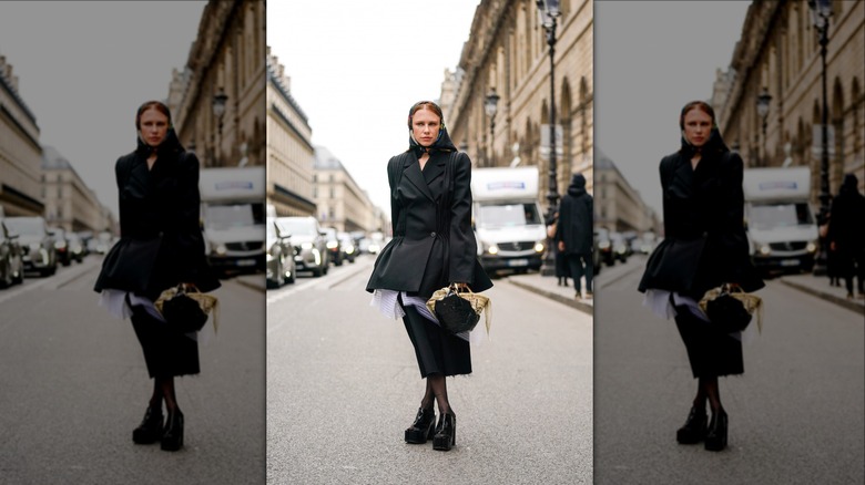 woman wearing minidress over skirt