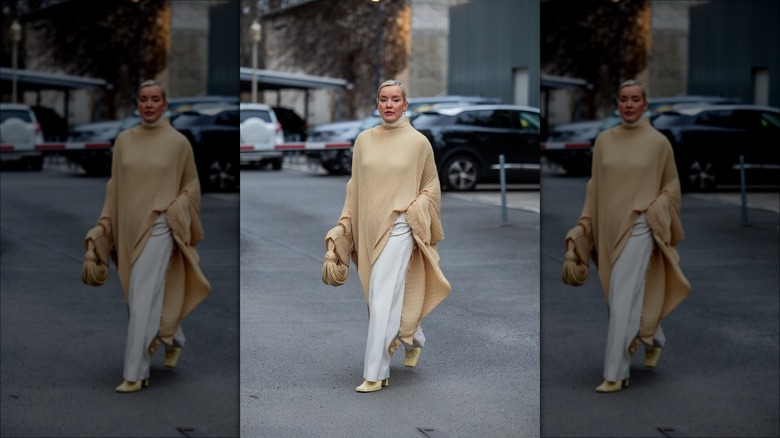 woman wearing oversized dress over pants