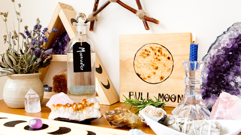 Pagan altar with crystals and moon water