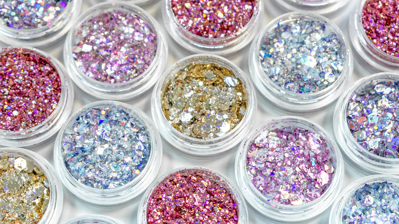 Tubs of loose nail glitter