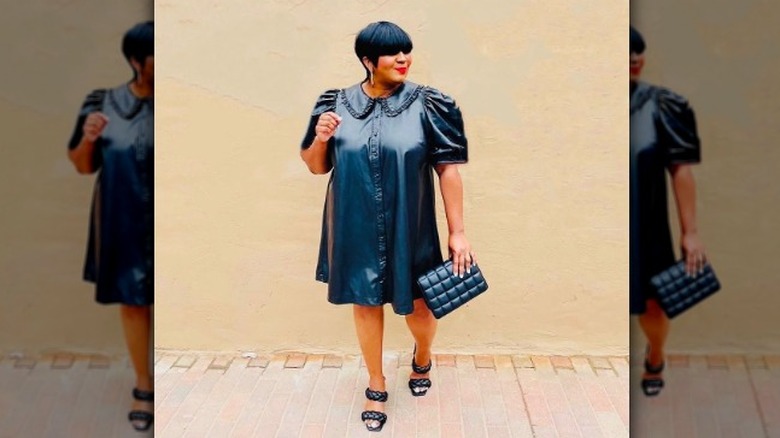 Girl wearing a leather summer dress.