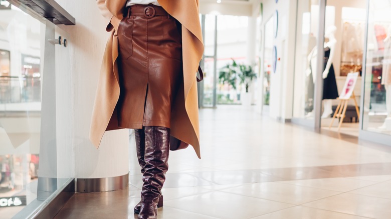 Close up of leather skirt and leather boots